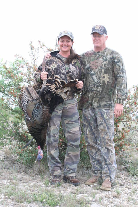 Man and Woman Turkey Hunters with bagged turkey at El Rancho Arenosa